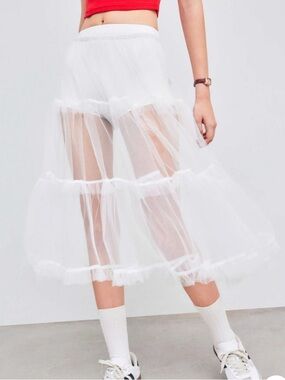 Women's sheer white skirt, size S—perfect for layering over a dress.